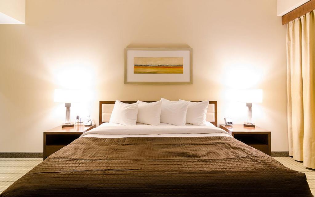 Spacious modern hotel room with soft bedding